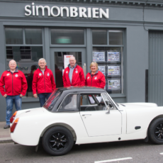 Simon Brien event sponsor, beside his 1960's MG Midget Atlantis GT, along with (left to right) Craig Hunt, Deputy Clerk of the Course, Wilson Carson, Clerk of the Course, and Sharon Carson, Secretary of the Meeting who are all delighted with the high quality entry list